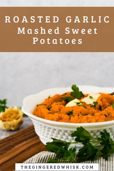 roasted garlic mashed sweet potatoes in a white bowl with parsley on the side