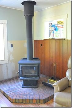 a living room with a wood stove in it