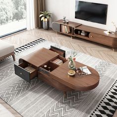 a living room with a couch, coffee table and television on top of the tv stand