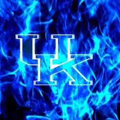 the letter k is surrounded by blue flames