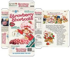 an old fashioned strawberry shortcake box with the front and back cover open to reveal it's contents