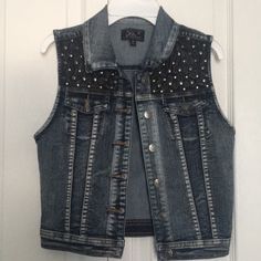 Blue Denim Studded Stretchy Vest. Never Used. Size M Trendy Stretch Blue Denim Vest, Trendy Blue Stretch Denim Vest, Blue Stretch Denim Vest, Blue Stretch Denim Jacket, Trendy Fitted Blue Denim Vest, Fitted Distressed Denim Vest, Trendy Dark Wash Denim Vest, Blue Fitted Edgy Jeans, Edgy Fitted Blue Jeans