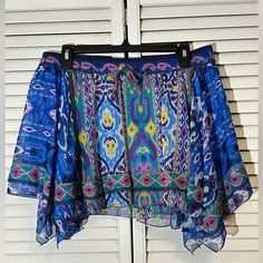 Colorful Flowy Ultra Light Polyester, This Little Thing Has An Equally Light Liner That Keeps Everything But Your Gorgeous Legs Concealed. It’s Made By Zara In Morocco, And Has A Lively Traditional Motif In The Print. Asymmetrical Hem Keeps The Skirt Moving With You. Nwt Size L Measurements Approximate 17” Waist 14” Waist To Hem Flowy Blue Skirt For The Beach, Flowy Blue Skirt For Day Out, Blue Stretch Summer Skirt, Flowy Blue Bottoms For Day Out, Bohemian Multicolor Skirt For Day Out, Casual Blue Bottoms With Vibrant Print, Blue Flowy Skirt For Beach Season, Blue Short Skirt For Vacation, Vibrant Blue Bottoms For Vacation