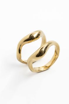 Discover The Figment Ring by Merchants of the Sun. These abstract 18k gold stacking rings are meticulously handcrafted with care. Designed to be unisex, these handmade stacking band rings offer endless possibilities for creating unique combinations. Elevate your style with the allure of 18k gold vermeil, reflecting the exceptional craftsmanship of Merchants of the Sun. Embrace the versatility and elegance of The Figment Ring, a perfect addition to your jewelry collection. A moment of sculptural Gold Stacking Rings, Stacking Bands, Gold Ring Stack, Recycled Sterling Silver, Metal Design, Ring Gold, Stacking Rings, Endless Possibilities, Nyx