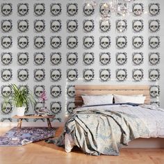 a bedroom with a skull wallpaper and bed