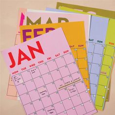 several calendars are stacked on top of each other