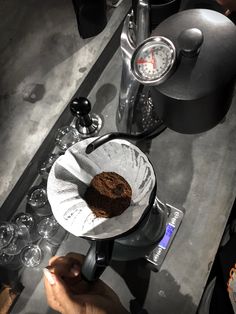 a person pours coffee into a cup