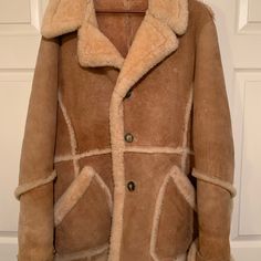 Beautiful Genuine Men’s Shearling Coat. There Is No Size Label, But Would Fit Men’s L Or Xl Or Women’s Xl. Beautiful Quality. Very Soft Inside. Exceptional Craftsmanship And Warmth. Measurements: Length Is 32”. Sleeve From Shoulder To Cuff: 28” Armpit To Armpit Across Front, Buttoned: 22.5”. Armpit To Armpit Across Back, Buttoned 22.5”. Like New. Barely Worn. Buttons Are Antler Or Horn. Fitted Brown Sheepskin Outerwear, Luxury Brown Sheepskin Outerwear, Rugged Brown Shearling Outerwear, Designer Brown Shearling Outerwear, Luxury Brown Shearling Fur Coat, Fit Men, Size Label, Shearling Coat, Tanning