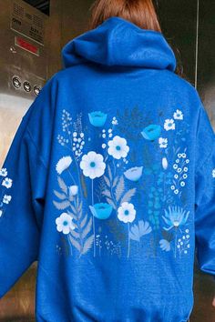 Stay cozy with this brown wildflower hoodie featuring a beautiful sleeve design—perfect for adding a touch of nature to your look! 🌼🍂 #WildflowerHoodie #NatureStyle Blue Spring Sweatshirt With Drawstring Hood, Blue Drawstring Hood Sweatshirt For Spring, Blue Hooded Sweatshirt For Spring, Blue Sweatshirt With Drawstring Hood For Spring, Blue Hooded Hoodie For Spring, Blue Spring Hoodie With Adjustable Hood, Spring Blue Hoodie With Adjustable Hood, Blue Cotton Hoodie For Spring, Blue Hoodie With Adjustable Hood For Spring