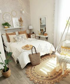 a bedroom with a bed, rugs and other items on the floor in front of a window