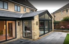 an outside view of a house with glass doors