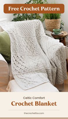 a white crochet blanket sitting on top of a couch next to a potted plant