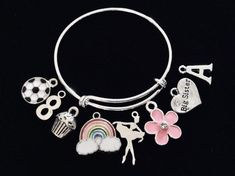 Use this link if you would like to add Birthstones to this bracelet ~ https://www.etsy.com/listing/774404837Little Girl Size adjustable bracelet normally fits children 8 -13 years old (estimation). (This is the Medium Size)Expandable and Completely Adjustable. Medium Size pictured is 4 1/2 inches.  Can be adjusted as small as needed by Gently squeezing the bracelet smaller.  This Medium sized Child bracelet will expand to fit up to a 6 inch wrist.  Stainless Steel Split rings attach charms to ba Customizable Pink Charm Bracelet For Birthday, Whimsical Pink Charm Bracelet For Birthday, Birthday Charm Bangle Bracelet, Themed Pink Bracelets For Birthday, Pink Themed Birthday Bracelets, Pink Charm Bracelets For Birthday Gift, White Charm Bracelet For Birthday, Pink Charms Bracelets For Birthday Gift, Fun Personalized Charm Bracelet For Birthday