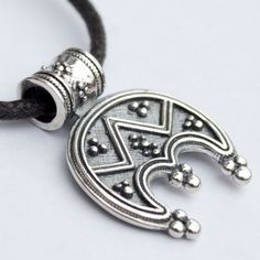 "Slavic Moon symbol/ Pagan Wiccan necklace/ Norse Viking jewelry with meaning Lunula pendant. Celtic women's amulet. Stamped 925 Sterling Silver Lunula (or Lunitsa) is a powerful female charm. Lunula (or Lunitsa) is an ancient Slavic and Viking female amulet. It symbolizes fertility, happy life and good luck. As the Moon has been always associated with female nature, the Lunula pendant is able to connect your female energy with lunar cycle. Lunula mascot is a powerful talisman against evil spiri Symbolic Good Luck Jewelry With Coin Pendant, Spiritual Sterling Silver Coin Pendant Jewelry, Sterling Silver Spiritual Coin Pendant Jewelry, Amulet Style Coin Pendant Jewelry, Silver Medallion Necklace In Symbolic Style, Silver Symbolic Round Pendant Necklace, Good Luck Amulet Jewelry With Round Pendant, Symbolic Engraved Round Pendant Jewelry, Silver Spiritual Moon Charm Necklace