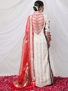 Garad Angrakha Lehenga - Inspired by gauri(durga), this lehanga set brings elements of akalbodhan, translating to the untimely awakening of Durga. The set features a gota bralette, an angrakha jacket and a full-pleated skirt, making it a perfect royal garment for your special occasions. Tussar Silk Palazzo Set For Festivals, Festive Tussar Silk Palazzo Set With Cutdana, Anarkali Tussar Silk Set With Traditional Drape, Anarkali Tussar Silk Set, Festive Palazzo Set With Cutdana In Tussar Silk, Bollywood Style Tussar Silk Set For Festive Occasions, Festival Semi-stitched Tussar Silk Palazzo Set, Festive Bollywood Style Tussar Silk Sets, Tussar Silk Traditional Drape Palazzo Set For Festivals