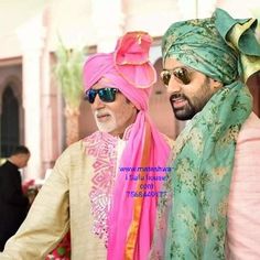 two men in turbans standing next to each other