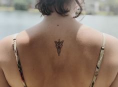 a woman with a tattoo on her back