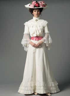 "Butterick B5970 Late Victorian Edwardian Period Misses Ruffled Tops and Floor-Length Skirts Retail $19.95 Sewing Rating: Advanced A beautiful late Victorian and Edwardian Period Close-fitting, lined, boned, gathered top has attached stand-up collar, yokes, and four-piece, gathered sleeve variations. A: Epaulettes and purchased appliqués. B: Hand-tacked collar overlay and flared sleeves. Underlined skirt has waistband, gored seams, back (extends into train) pleats, and placket. Top and Skirt: bi Historical Dress Patterns, Lace Blouse Patterns, Pola Rok, Butterick Dress Patterns, Edwardian Costumes, Ruffled Tops, Dresses By Pattern, Plum Dress, Afrikaanse Mode