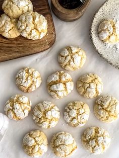 a table topped with cookies and powdered sugar