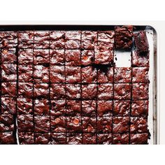 a pan filled with brownies on top of a table