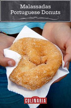 a person holding a donut in their hands with the words, maasasadas portuguese donuts