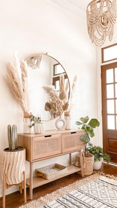 a living room with a mirror, table and plants