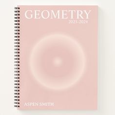 a pink spiral notebook with the words geometry written in white lettering on it