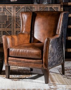 Looking for a luxurious and comfortable leather chair that's handcrafted in America? Look no further than the Artesia Leather Chair! This wingback chair features a tight back and full grain leather with hand burnished details, ensuring a premium look and feel. Plus, with brindle cowhide wrapping along the sides and back, this chair is truly a showstopper. Made with 8-way hand tied construction and the highest quality upholstery grade materials, the Weston Leather Chair is built to last. Don't settle for anything less than the best - upgrade your living space with the Weston Leather Chair today! Adobe Interior, Brindle Cowhide, Western Rustic, Western Furniture, Bunker Hill, Oregon Trail, Accent Arm Chairs, Leather Artisan, Hill House