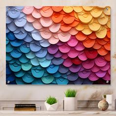 a colorful wall hanging above a white table