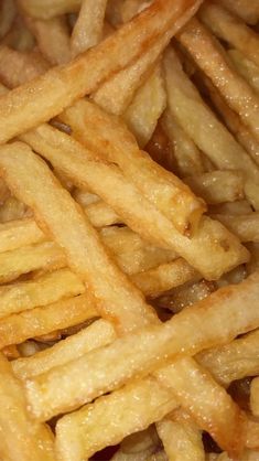 close up view of french fries with oil on them