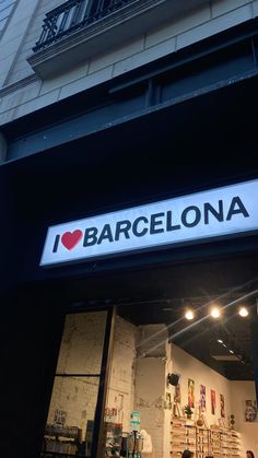 i love barcelona sign above the entrance to a store