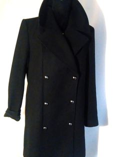 Wool and viscose coat. In good condition. Fits loosely. The length of the coat can be adjusted to fit you by sewing on the buttons. The length of the coat is above the knee. According to European sizes 38, US 6, UK 10, S-M-L M size. In good condition. Shoulder width 41cm/16.4" Arm length 60cm/24" Back length 82cm/32" Chest width at the front 50cm/20" Please compare these sizes with clothing that fits you well. If you have questions or need an additional photo, write. I will be happy to answer. T Black Long Coat Outerwear With Buttons, Black Long Coat With Buttons, Military Style Pea Coat With Double Button Closure, Winter Outerwear With Covered Buttons And Lapel Collar, Black Double-breasted Outerwear With Button Closure, Long Coat With Covered Buttons For Fall, Fall Long Coat With Covered Buttons, Military Style Long Coat With Buttons, Military Long Coat With Buttons