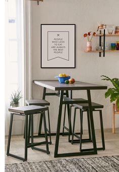 an ad for the ikea store showing two stools and a table with fruit on it