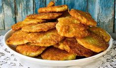 some fried food in a white bowl on a table