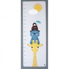 a growth chart with giraffes and a sun on the back of it