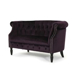 a purple couch with studded arms and legs