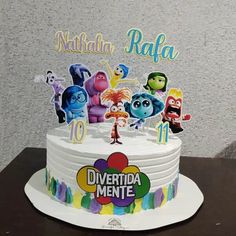 there is a birthday cake with the names of all the characters on it and an edible topper