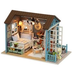 a doll house with furniture and accessories in it