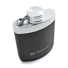 an image of a black and silver flask with the name stanley on it