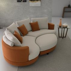 an orange and white couch with pillows on it