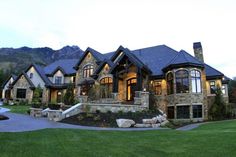 a large stone house with lots of windows