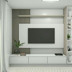 a living room with a flat screen tv mounted on the wall and shelves below it