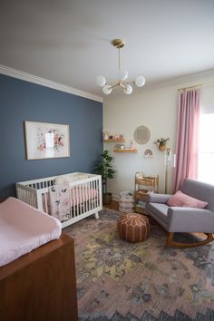 a baby's room with a rocking chair and crib