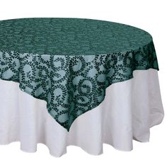 a round table with a green and white tablecloth