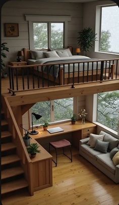 there is a loft bed in the middle of this living room with stairs leading up to it