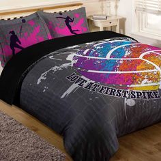 a bed room with a basketball comforter and pillows