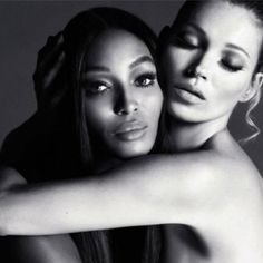 two beautiful women hugging each other in black and white