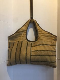 made from recycled fabric with a leather trim, lined and with an inside zipped pocket. It measures 19" x 18". Handmade Handbag, Handmade Handbags, Recycled Fabric, Leather Trim, Leather Trims, Purses And Handbags, Shoulder Bags, Recycling, Bathing Beauties