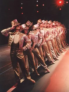 a group of people standing on top of a stage