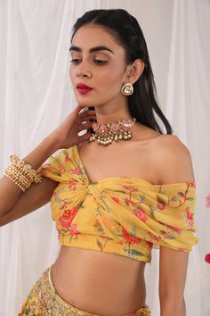 Mustard blouse in georgette base with floral printed motifs.
Component: 1
Pattern: Printed
Type Of Work: Floral Motifs
Neckline: One shoulder
Fabric: Semi Crepe, Georgette
Color: Yellow
Other Details: 
Draped blouse
Note: The lehenga worn by the model is not for sale
Occasion: Mehendi and Haldi - Aza Fashions Yellow Silk Top With Floral Print, Yellow Floral Print Silk Tops, Yellow Silk Blouse With Floral Print, Yellow Floral Print Silk Blouse, Floral Print Chiffon Blouse For Party, Floral Print Chiffon Party Blouse, Chiffon Floral Print Party Blouse, Yellow Floral Print Party Blouse, Party Yellow Blouse With Floral Print